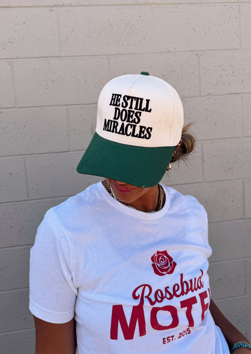 He Still Does Miracles Trucker Hat