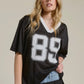 Sporty V Neck Jersey Top with 89 Graphic Print • BLACK